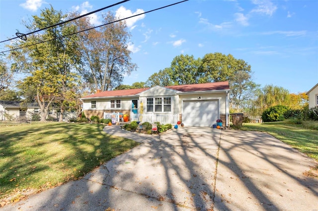 view of front of home featuring a garage, a front yard, and a porch