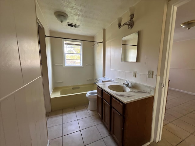 full bathroom featuring a textured ceiling, vanity, shower / bath combination, tile patterned floors, and toilet