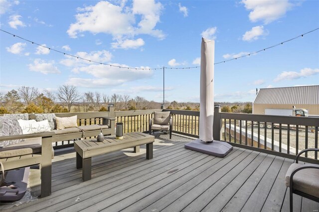 wooden terrace featuring an outdoor hangout area