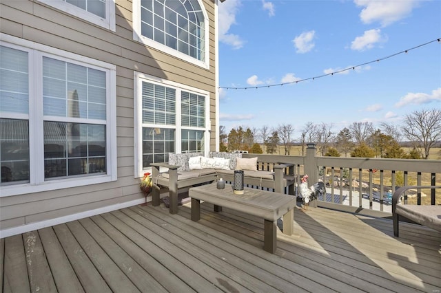 deck featuring outdoor lounge area