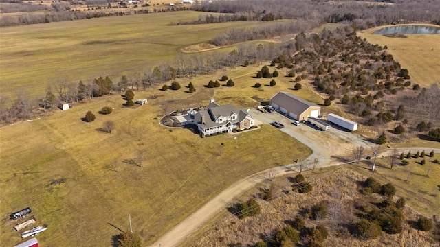 drone / aerial view featuring a water view and a rural view