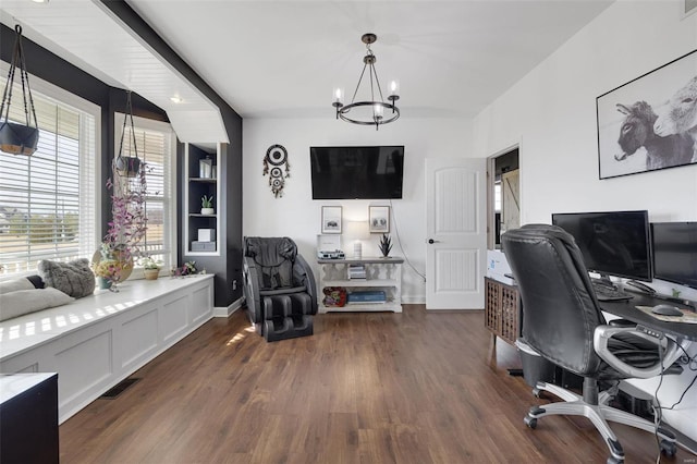 office area featuring dark wood-style floors, a chandelier, visible vents, and baseboards