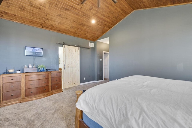 bedroom with a barn door, visible vents, baseboards, wooden ceiling, and carpet