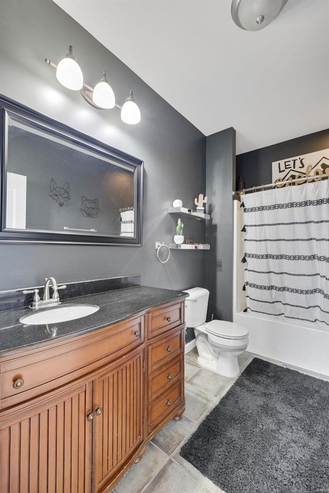 full bath featuring toilet, tile patterned floors, vanity, and shower / bathtub combination with curtain