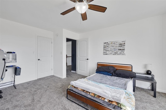 carpeted bedroom featuring ceiling fan and baseboards