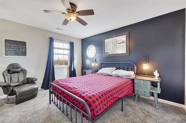 bedroom featuring carpet, visible vents, baseboards, and ceiling fan