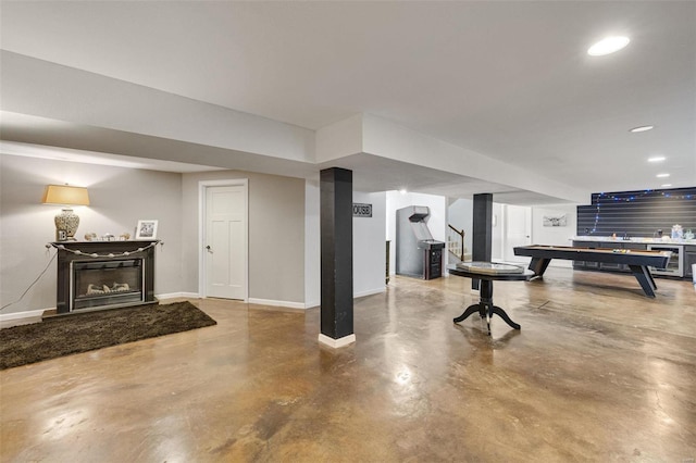 exercise room with pool table, recessed lighting, baseboards, and a glass covered fireplace