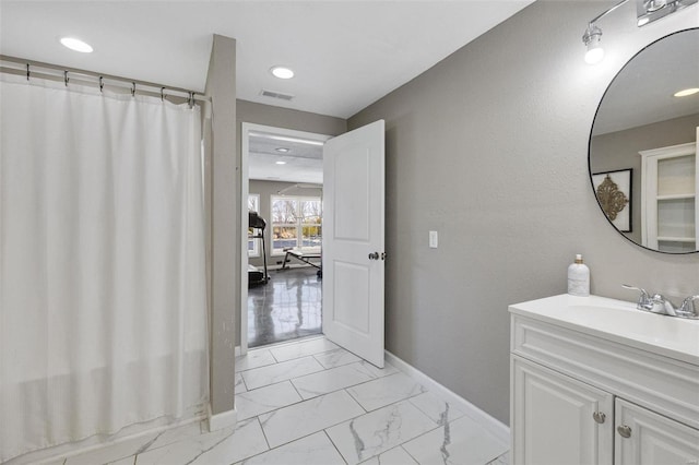 bathroom with visible vents, baseboards, marble finish floor, vanity, and recessed lighting