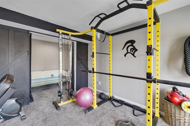 workout area with carpet and baseboards