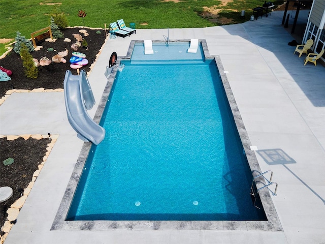 view of pool featuring a water slide