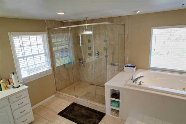 bathroom featuring tile patterned flooring and shower with separate bathtub