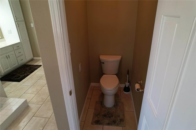 bathroom featuring tile patterned floors, toilet, and vanity