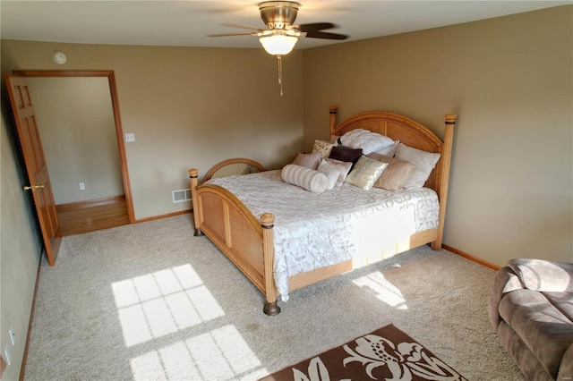 bedroom featuring light colored carpet and ceiling fan