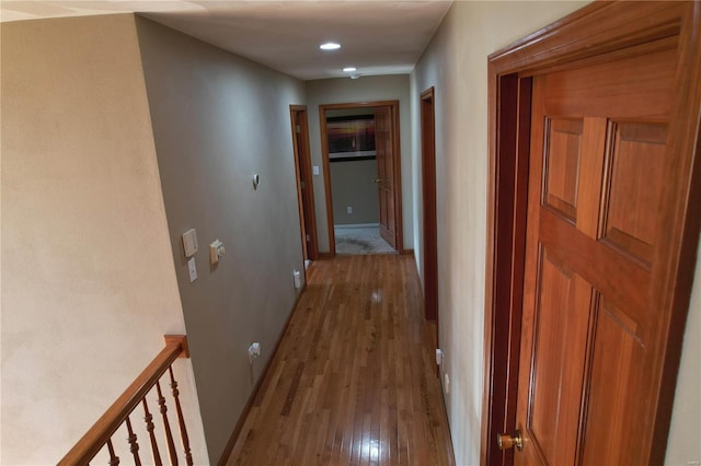 corridor with light wood-type flooring