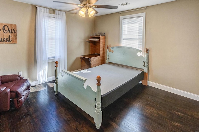 bedroom featuring dark hardwood / wood-style flooring and ceiling fan