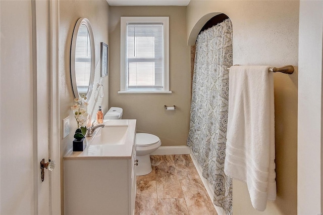 bathroom featuring toilet and vanity