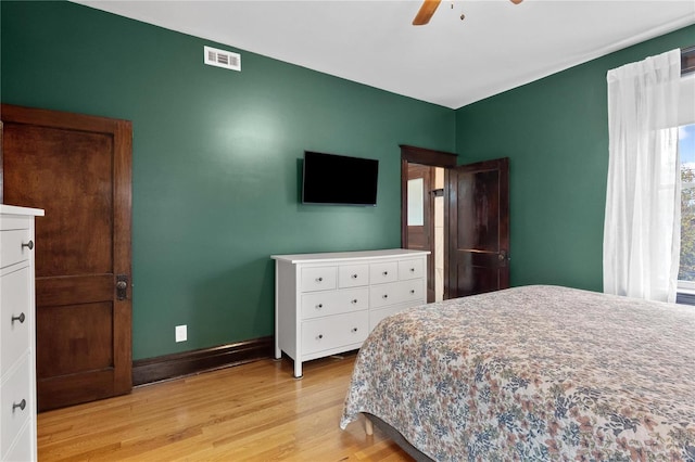 bedroom with ceiling fan and light hardwood / wood-style floors