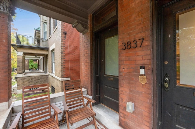 view of exterior entry featuring a porch