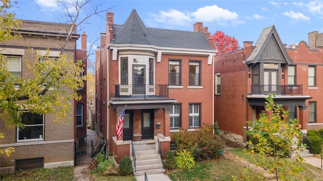 view of front of house with a balcony