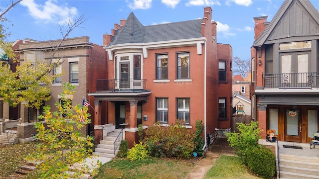 view of front of house featuring a balcony