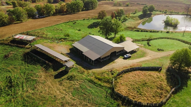 birds eye view of property with a water view and a rural view