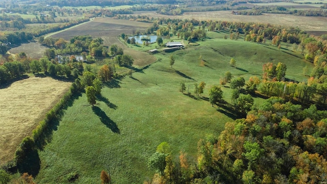 aerial view with a rural view and a water view