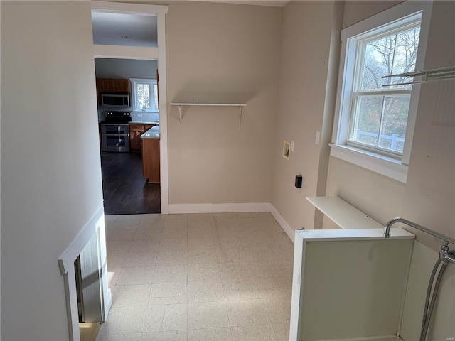 laundry room featuring hardwood / wood-style flooring