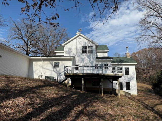 rear view of house featuring a deck and central air condition unit