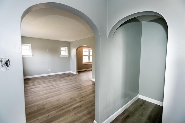 corridor with dark hardwood / wood-style floors