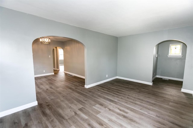 spare room featuring dark hardwood / wood-style floors