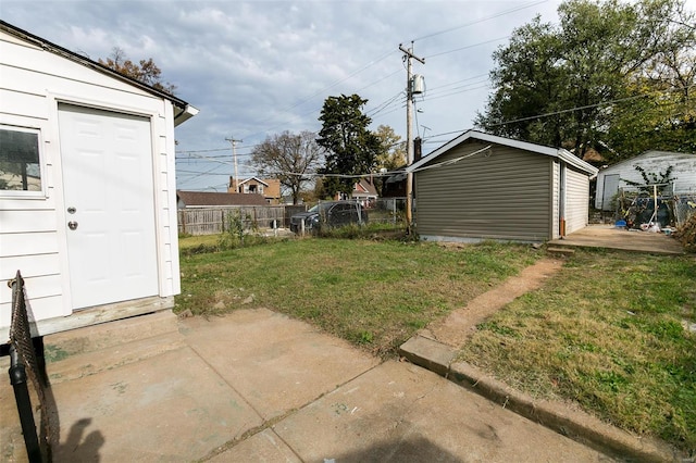 view of yard with a patio area and a storage unit