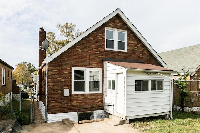 rear view of property featuring a patio area