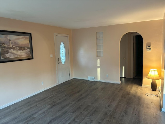 entrance foyer with dark wood-type flooring