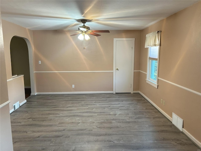 empty room with wood-type flooring and ceiling fan