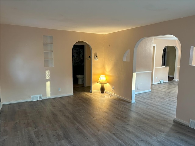 spare room featuring hardwood / wood-style flooring