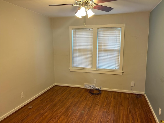 unfurnished room featuring ceiling fan and dark hardwood / wood-style floors