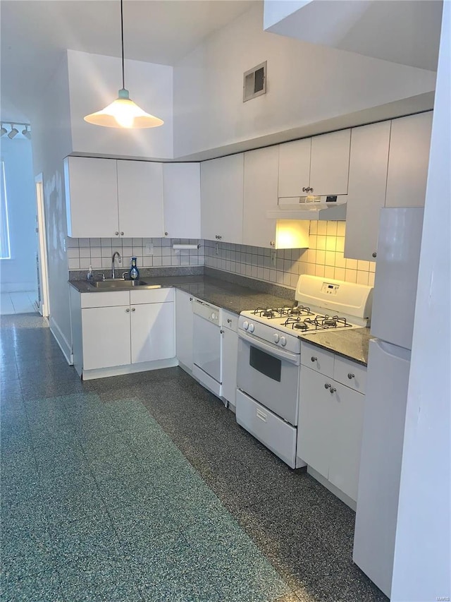 kitchen with white cabinetry, sink, hanging light fixtures, and white appliances