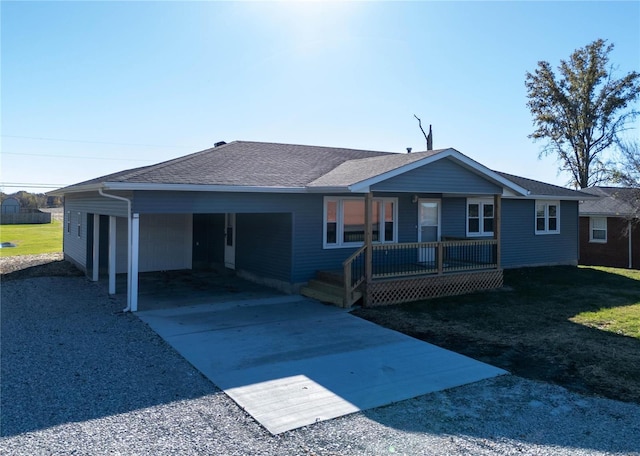 single story home featuring a porch and a carport