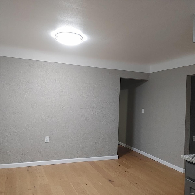 empty room with light hardwood / wood-style floors