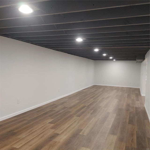 basement with hardwood / wood-style flooring