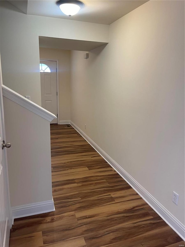 hallway featuring dark hardwood / wood-style floors