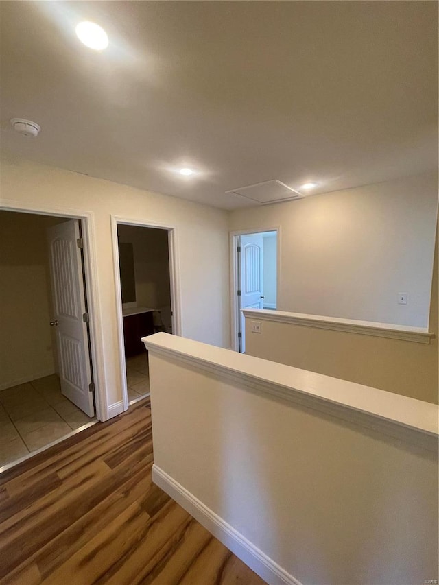 hall with hardwood / wood-style floors