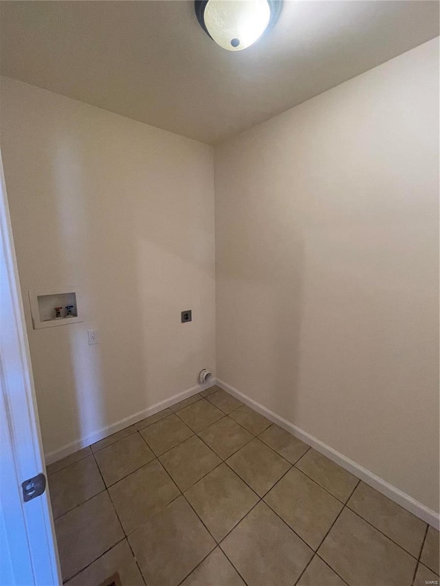 laundry area featuring hookup for an electric dryer, light tile patterned flooring, and washer hookup