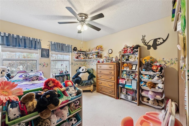 carpeted bedroom with a textured ceiling and ceiling fan