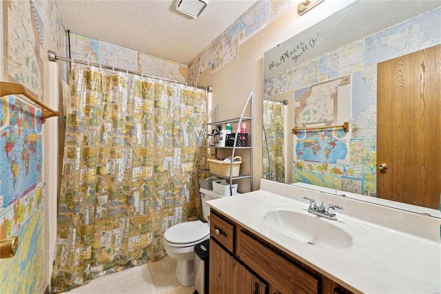 bathroom with walk in shower, vanity, a textured ceiling, and toilet