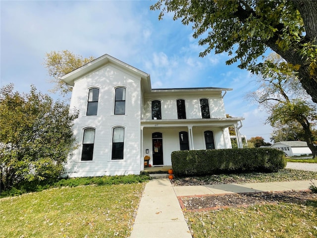 view of front of house featuring a front yard and a porch