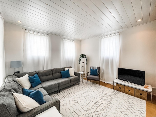 living room featuring hardwood / wood-style flooring and wood ceiling