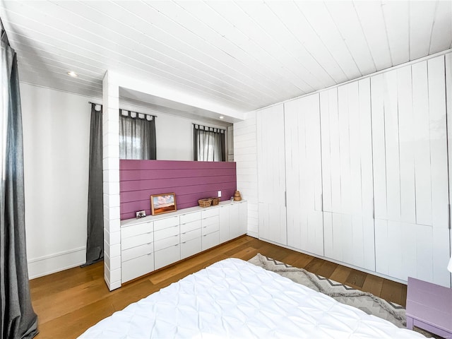 bedroom with hardwood / wood-style flooring