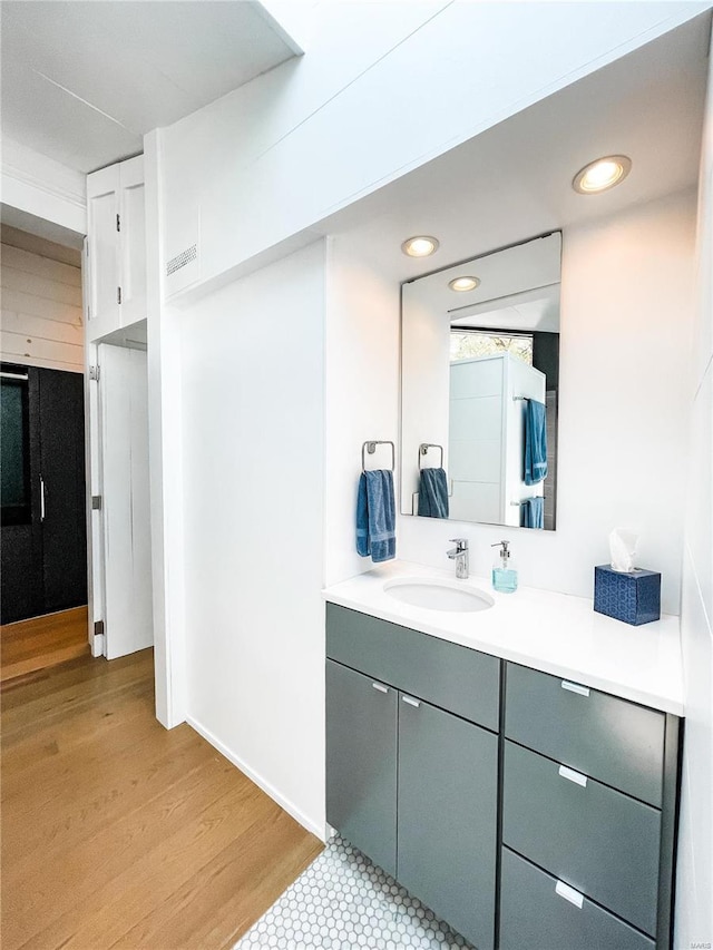 bathroom featuring vanity and hardwood / wood-style floors