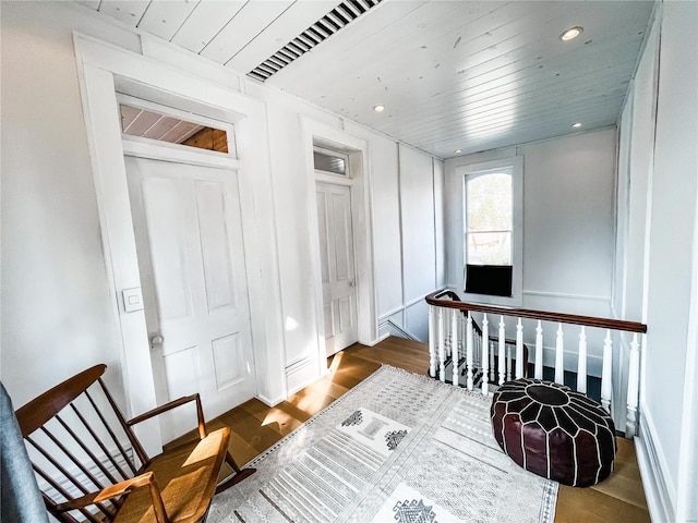 interior space with dark hardwood / wood-style floors and wood ceiling